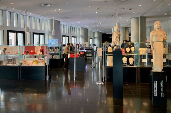 People buying in the acropolis museum shop